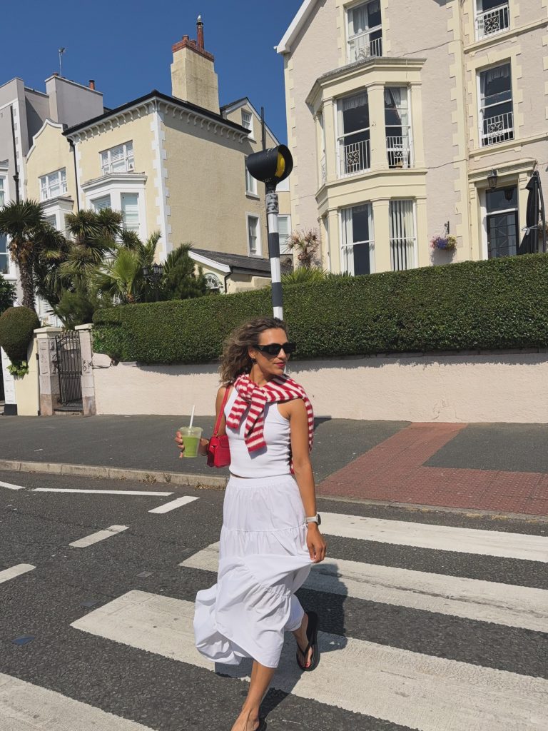 A White Skirt, White Tank, and Red Striped Sweater: The Crisp Summer Look with a Little Punch